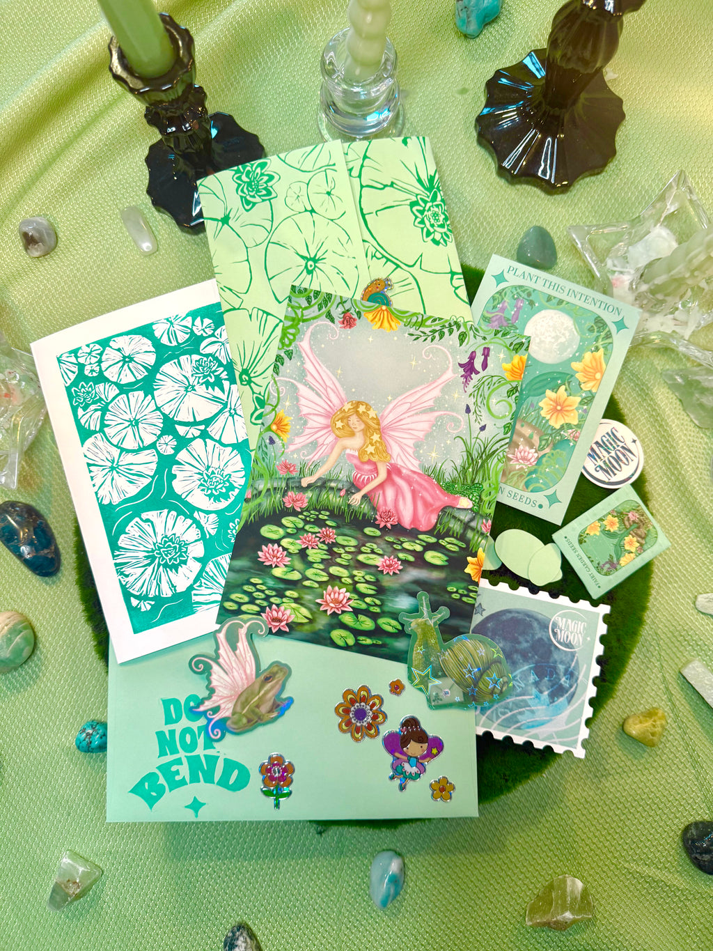 Collection of colorful stickers on a green textured surface with decorative elements.
